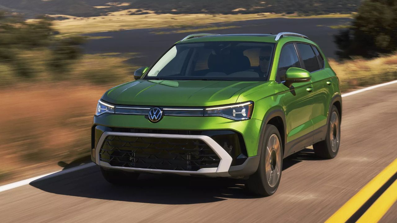 Green 2026 Volkswagen Taos equipped with the 4MOTION system on the road.