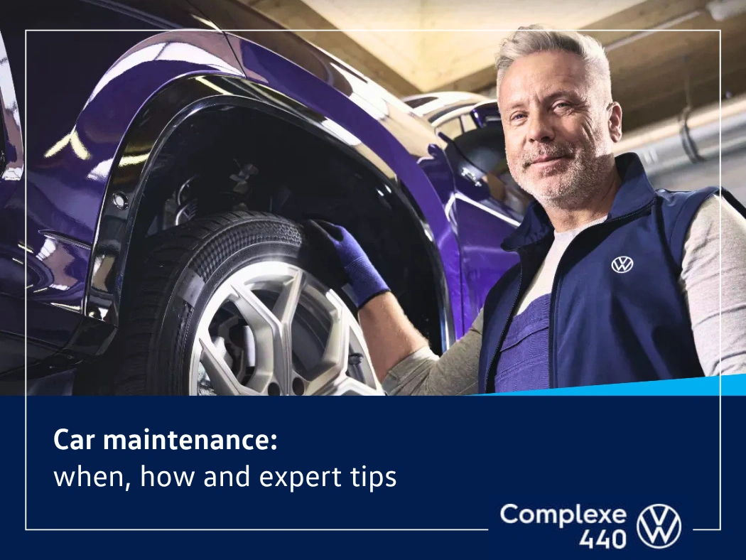 Volkswagen technician inspecting a wheel to explain when and how to maintain a car.