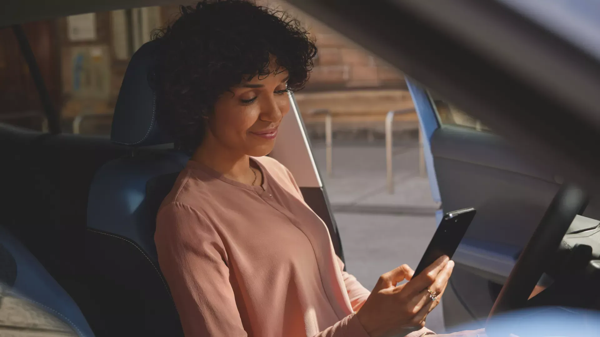 Driver preparing the value of her vehicle trade-in.