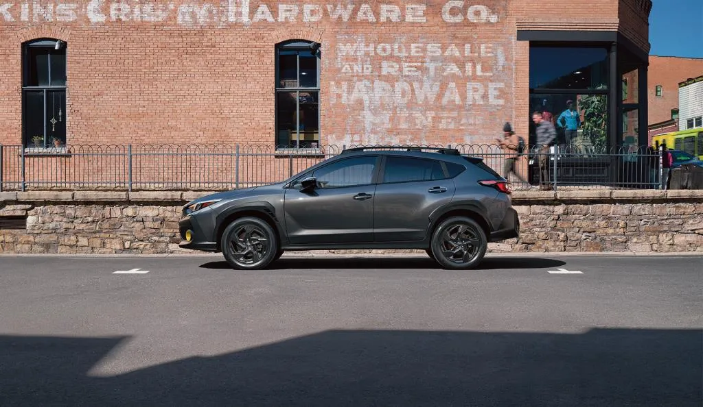 Grey 2026 Subaru Crosstrek in side profile.