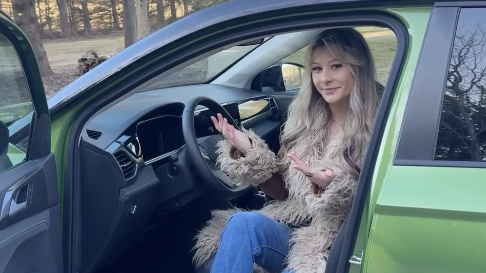 2026 Volkswagen Taos interior with driver.