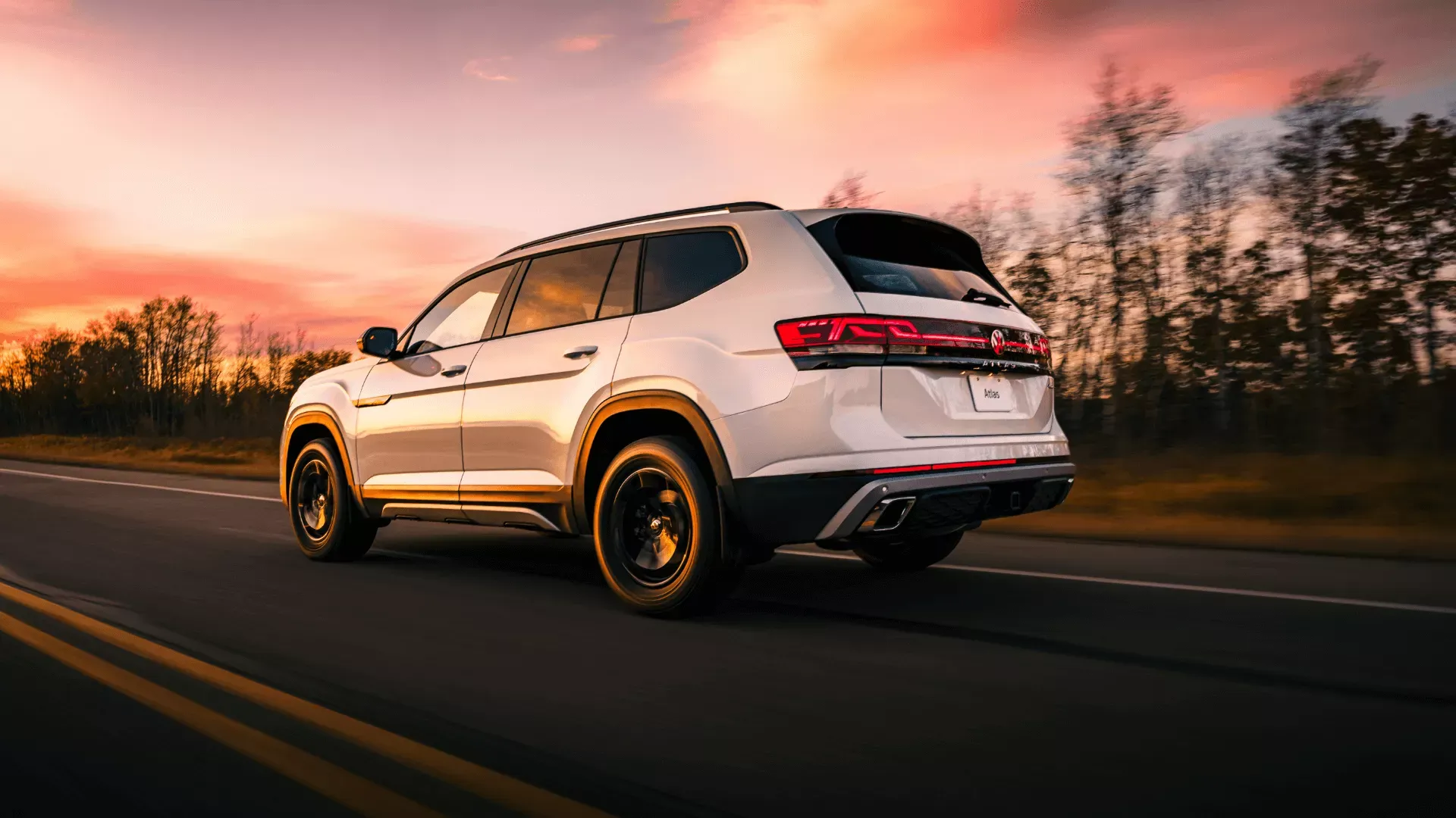 White 2026 Volkswagen Atlas on the road.