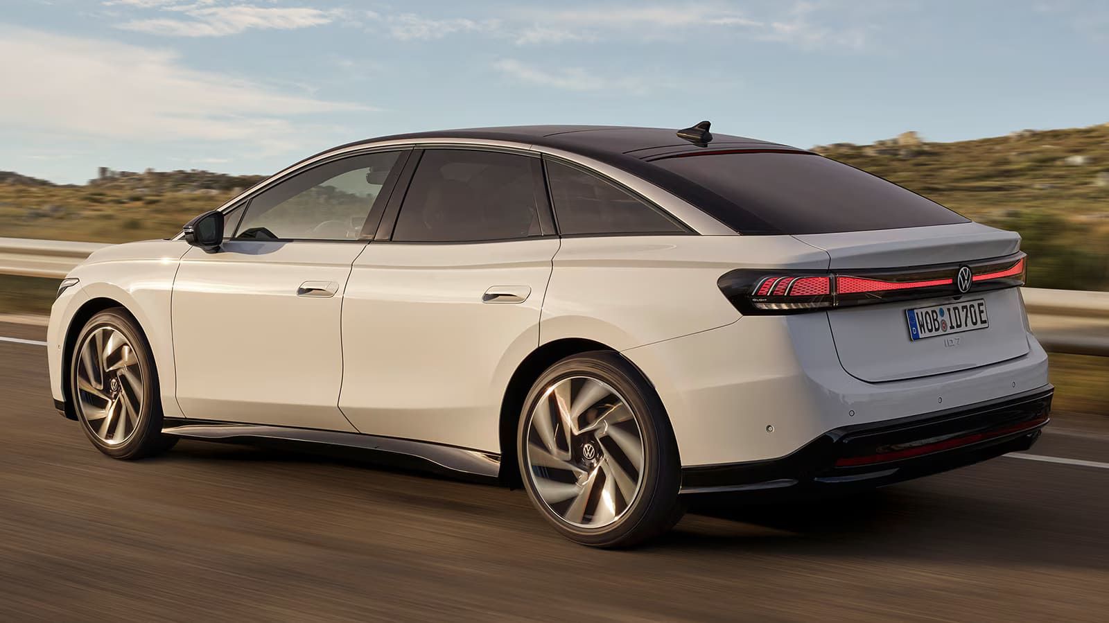 rear side view of a 2025 VW ID.7 on a desert road