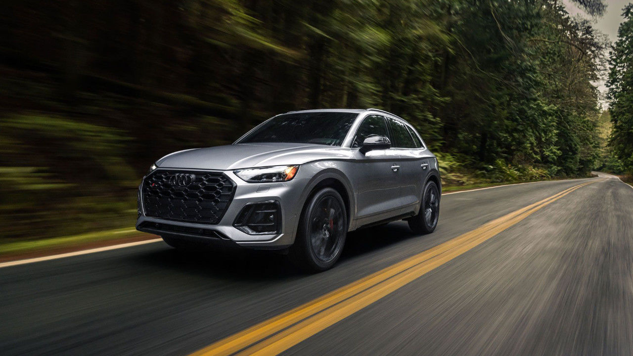 front side view of a 2025 Audi Q5 on a forest road