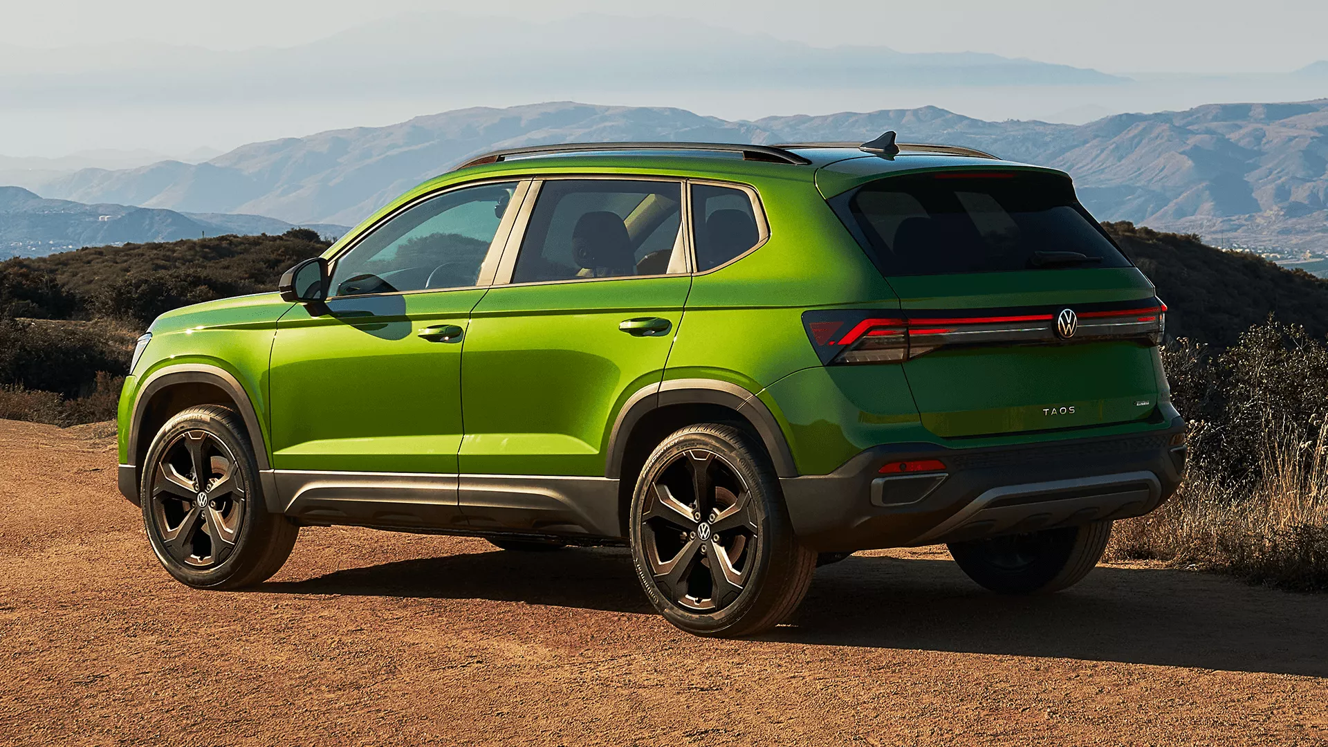 2026 Volkswagen Taos side profile showcasing updated design with alloy wheels and front light bar