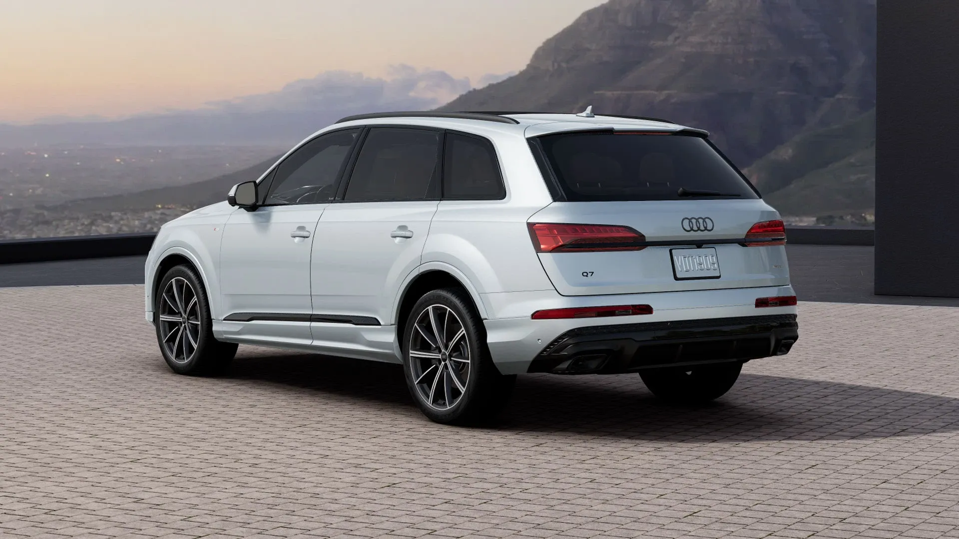White 2026 Audi Q7 seen from the rear outdoors to illustrate the Audi SUV pricing and trims.