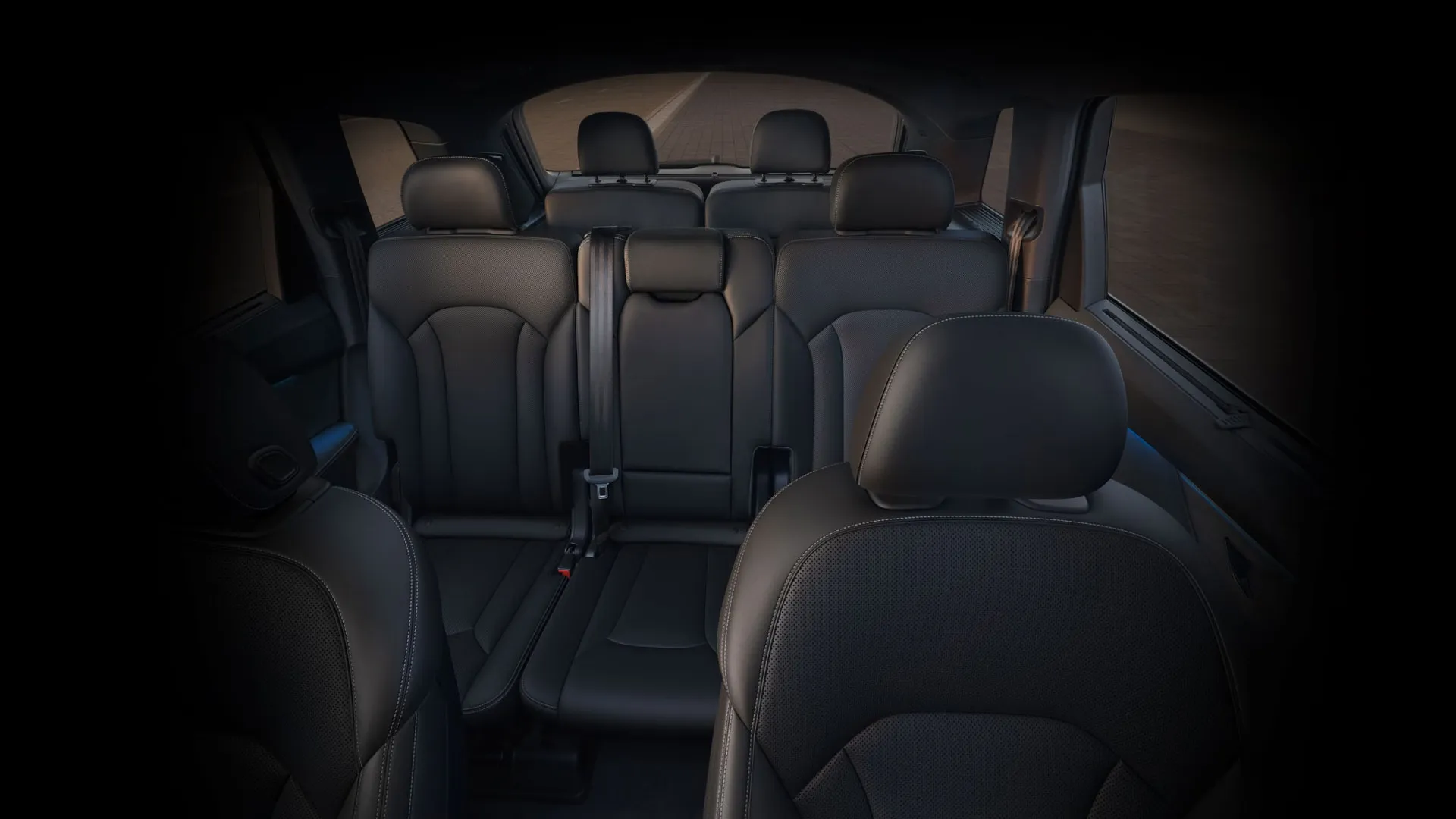 Interior of the 2026 Audi Q7 with three rows of seats to present the SUV's interior design.
