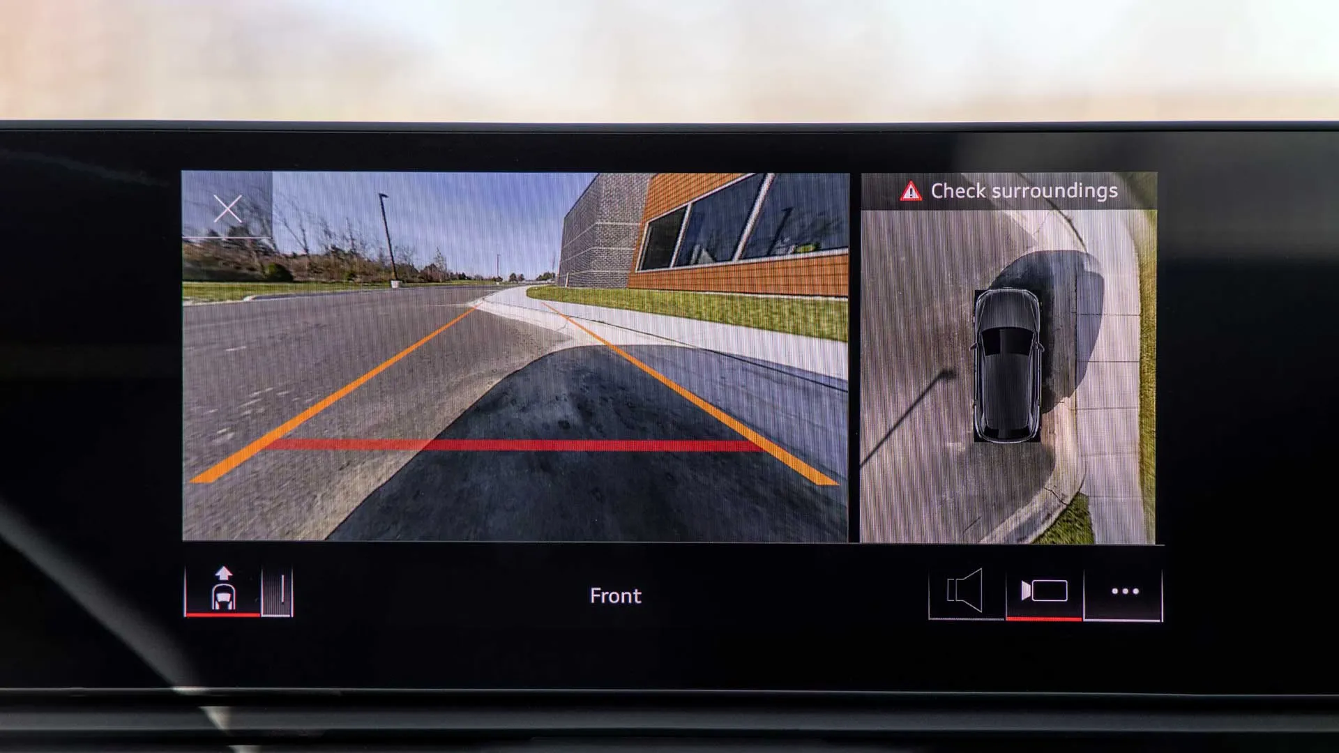 Backup camera screen and 360-view display in the 2026 Audi Q7 illustrating safety and driver assistance technologies.