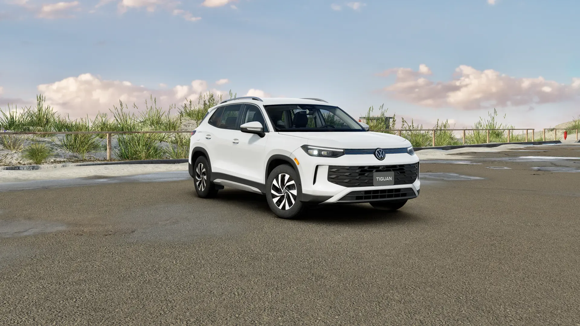 White 2026 Volkswagen Tiguan parked roadside to illustrate pricing and trims of the compact SUV.