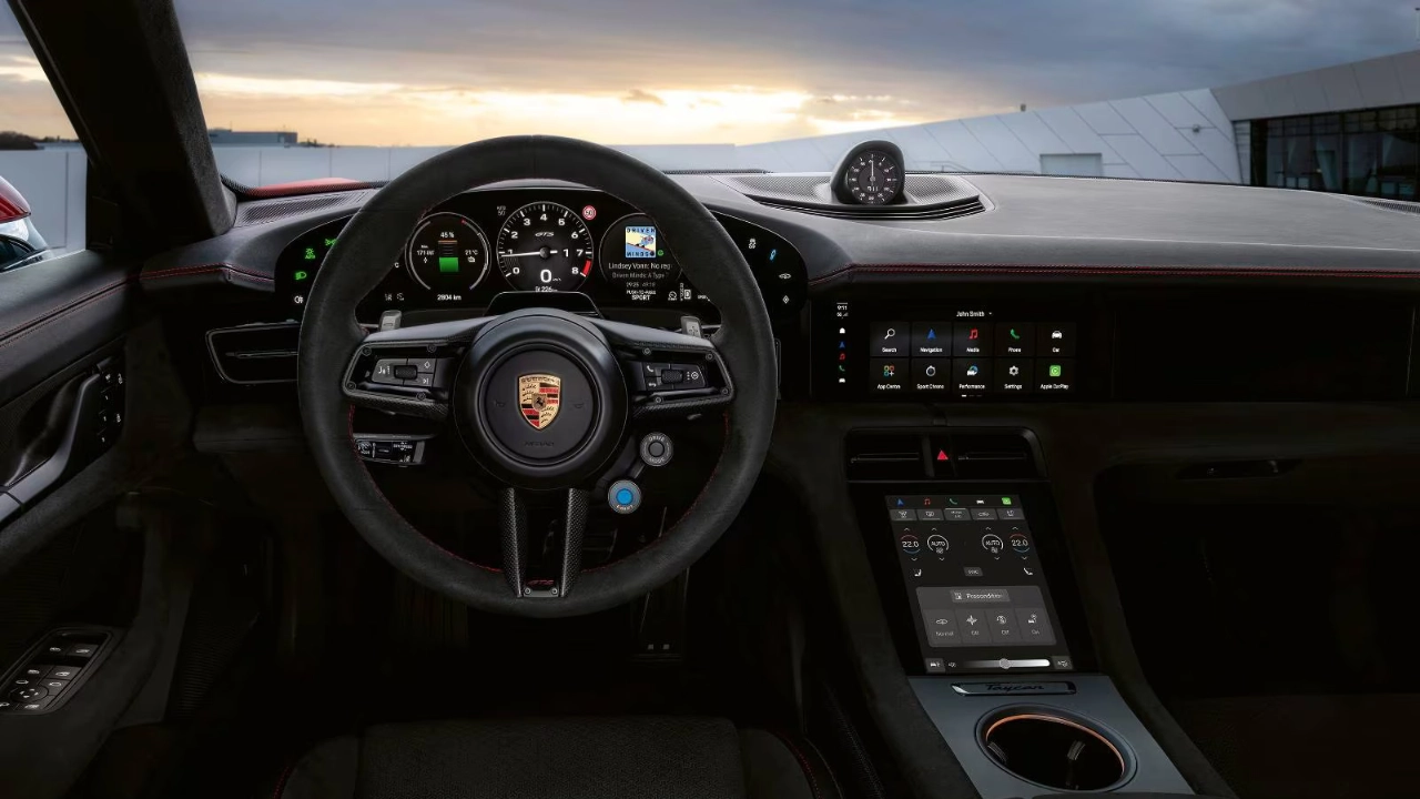 Close-up of the Porsche Taycan center console featuring the high-resolution infotainment touchscreen