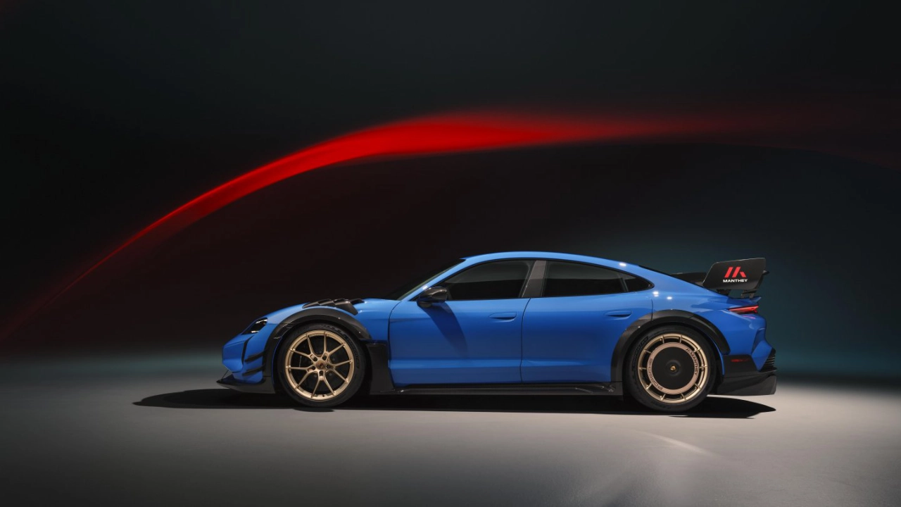 Side profile of the Porsche Taycan highlighting its sleek aerodynamic silhouette and alloy wheels