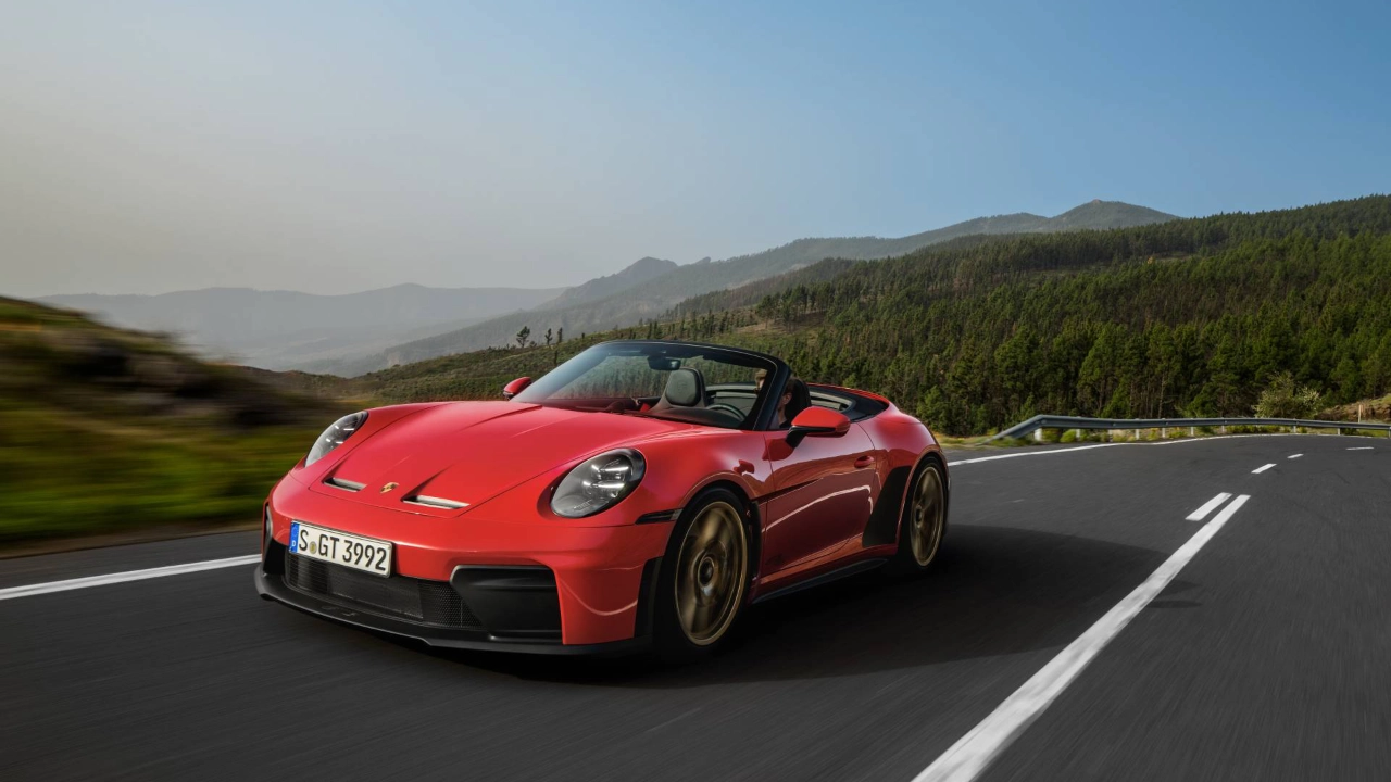 Porsche 911 GT3 S/C convertible sports car driving on a winding coastal road