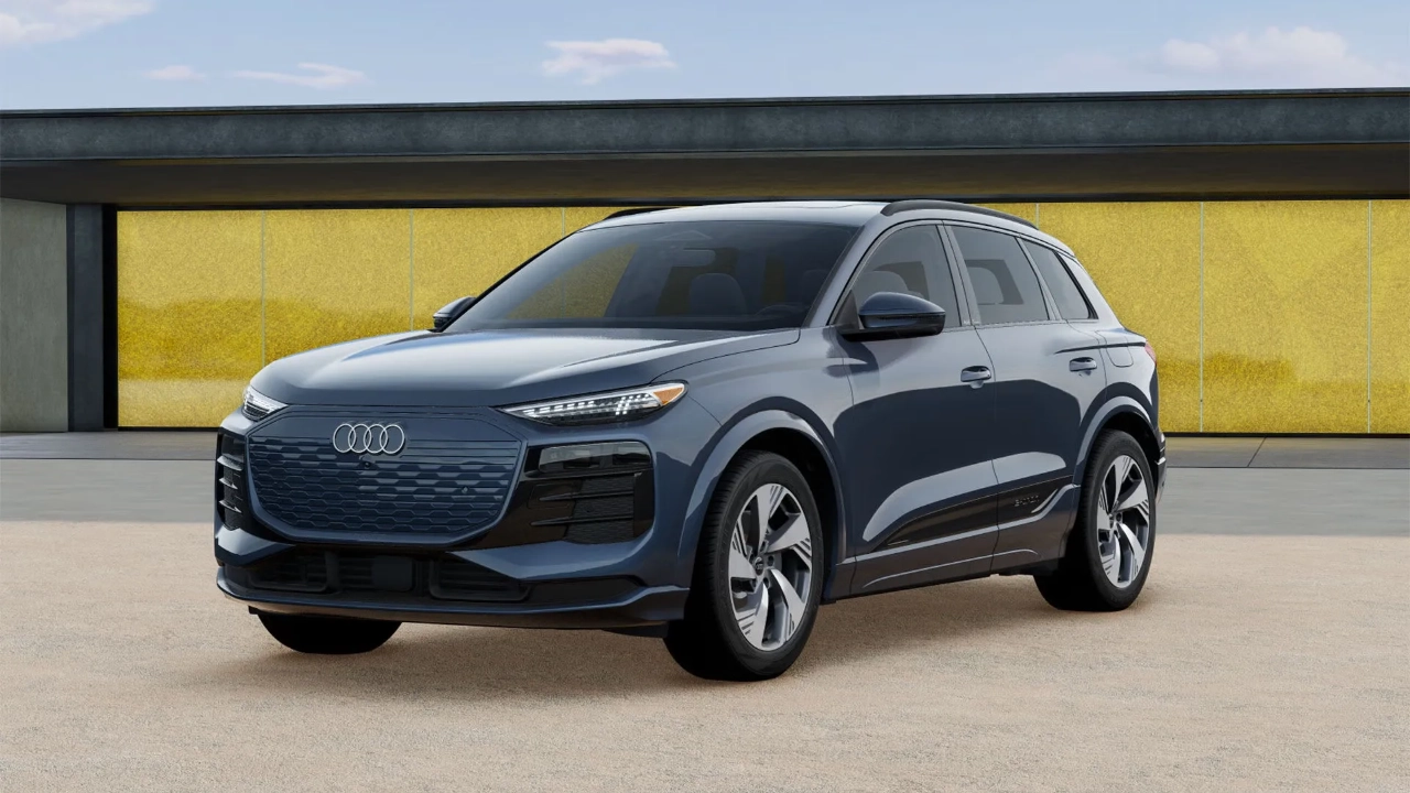 Front three-quarter view of the Audi Q6 e-tron luxury SUV in motion