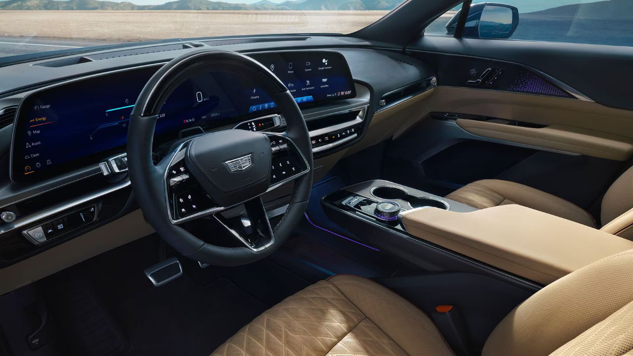 Modern interior of the Cadillac Lyriq featuring a wide curved dashboard screen