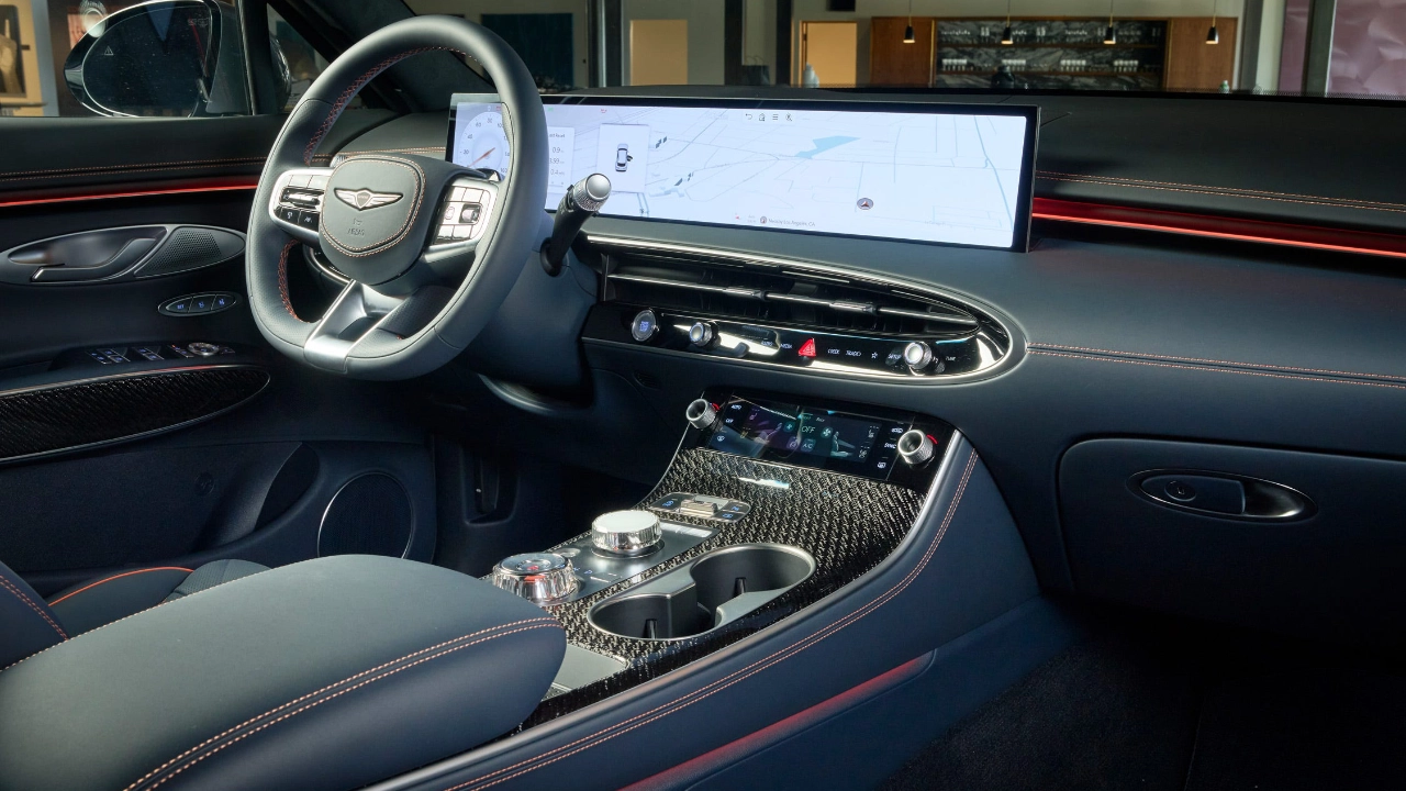 Interior view of the Genesis GV70 showcasing refined upholstery and infotainment display