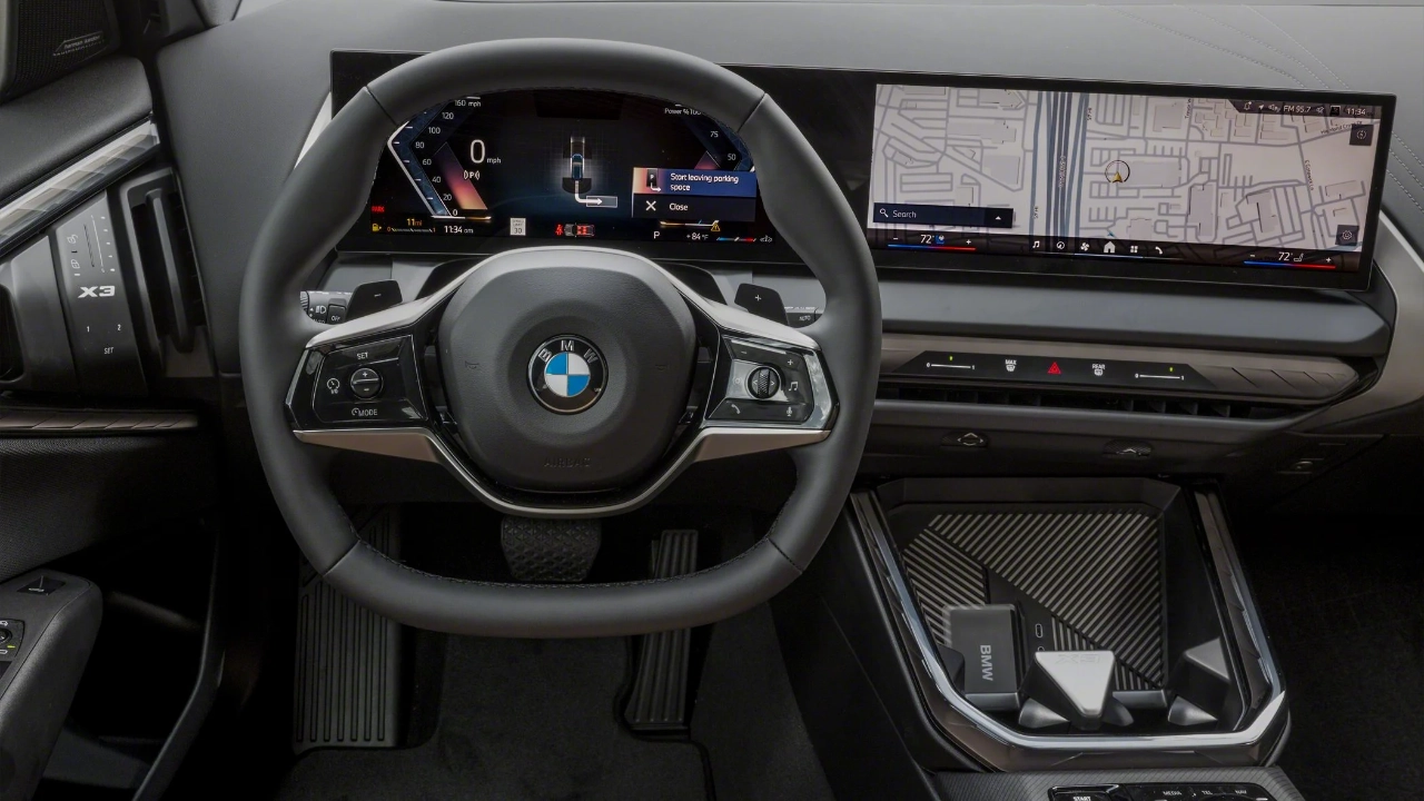 BMW X3 interior cockpit view featuring a wide curved digital display