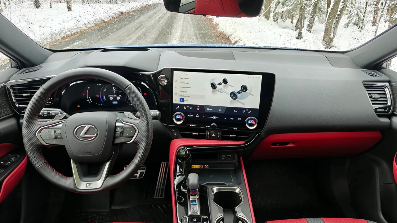 Interior cabin view of the Lexus NX showing the modern dashboard and steering wheel