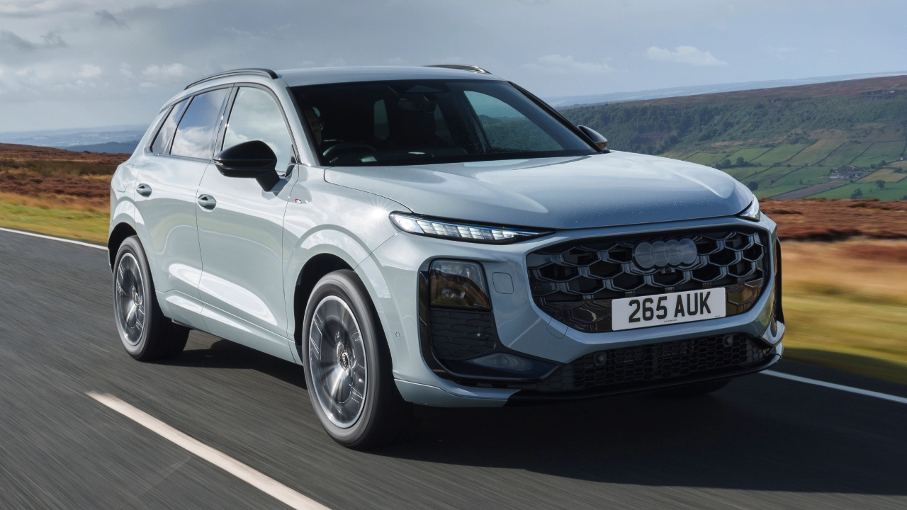 Front view of an Audi Q3 highlighting its radiator grille and headlights