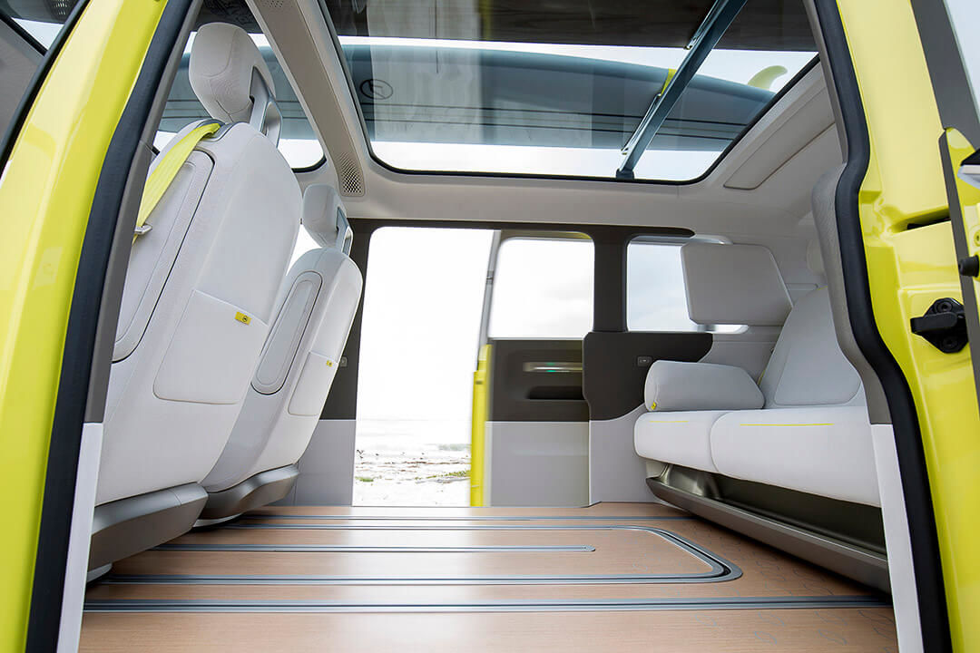 The modular interior of an electric VW Westfalia including its large rear bench seat