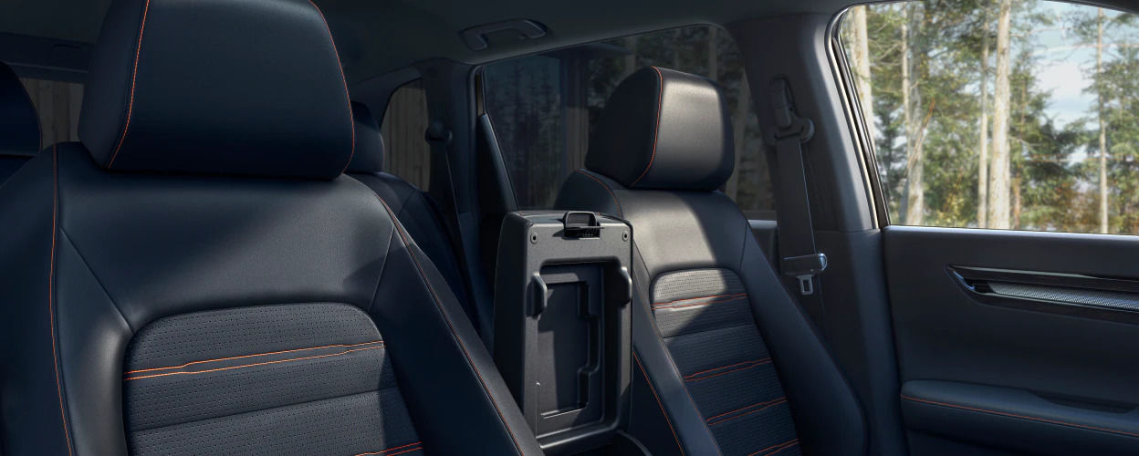 Perforated leather-trimmed seating surfaces with orange topstitch of the 2023 Honda CR-V Hybrid.
