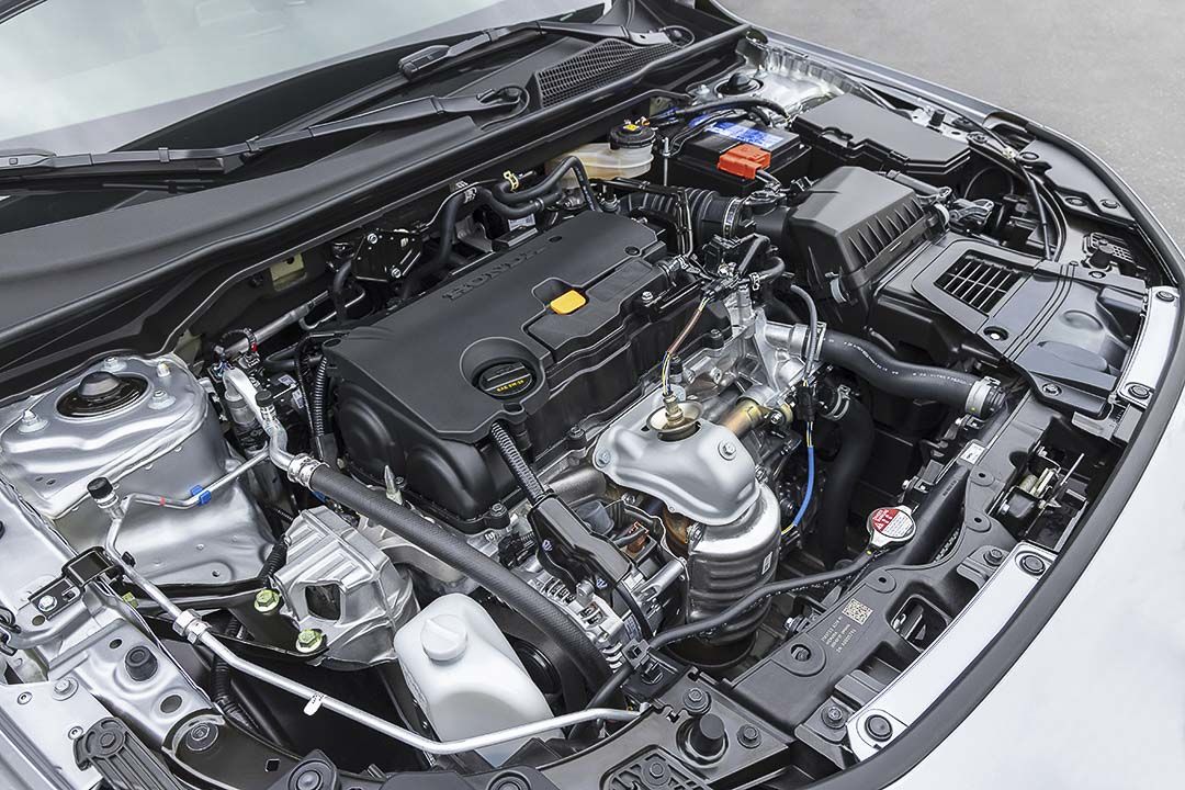 Under the hood of the 2022 Honda Civic Sport sedan unveiling its i-VTEC engine