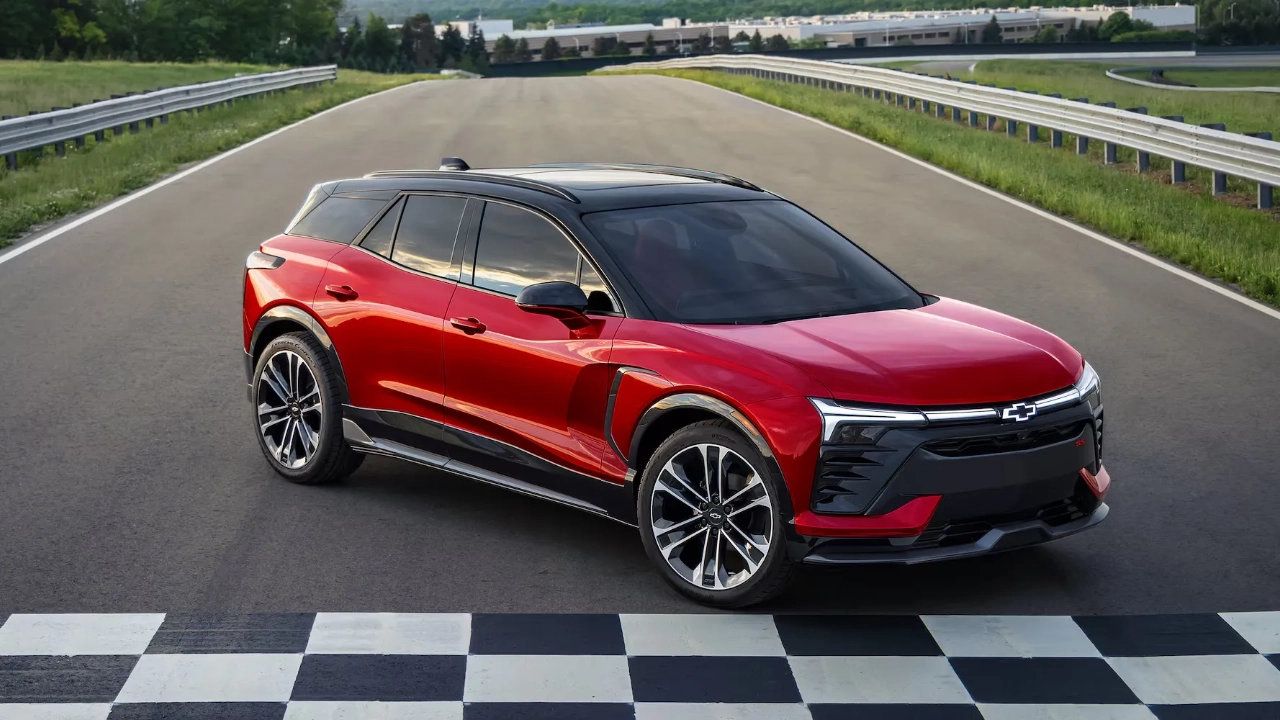 Front view of a 2026 Chevrolet Blazer SUV driving on a paved road