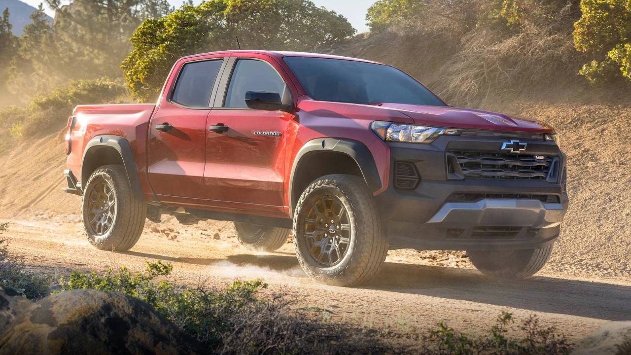Chevrolet Colorado midsize truck driving through natural terrain