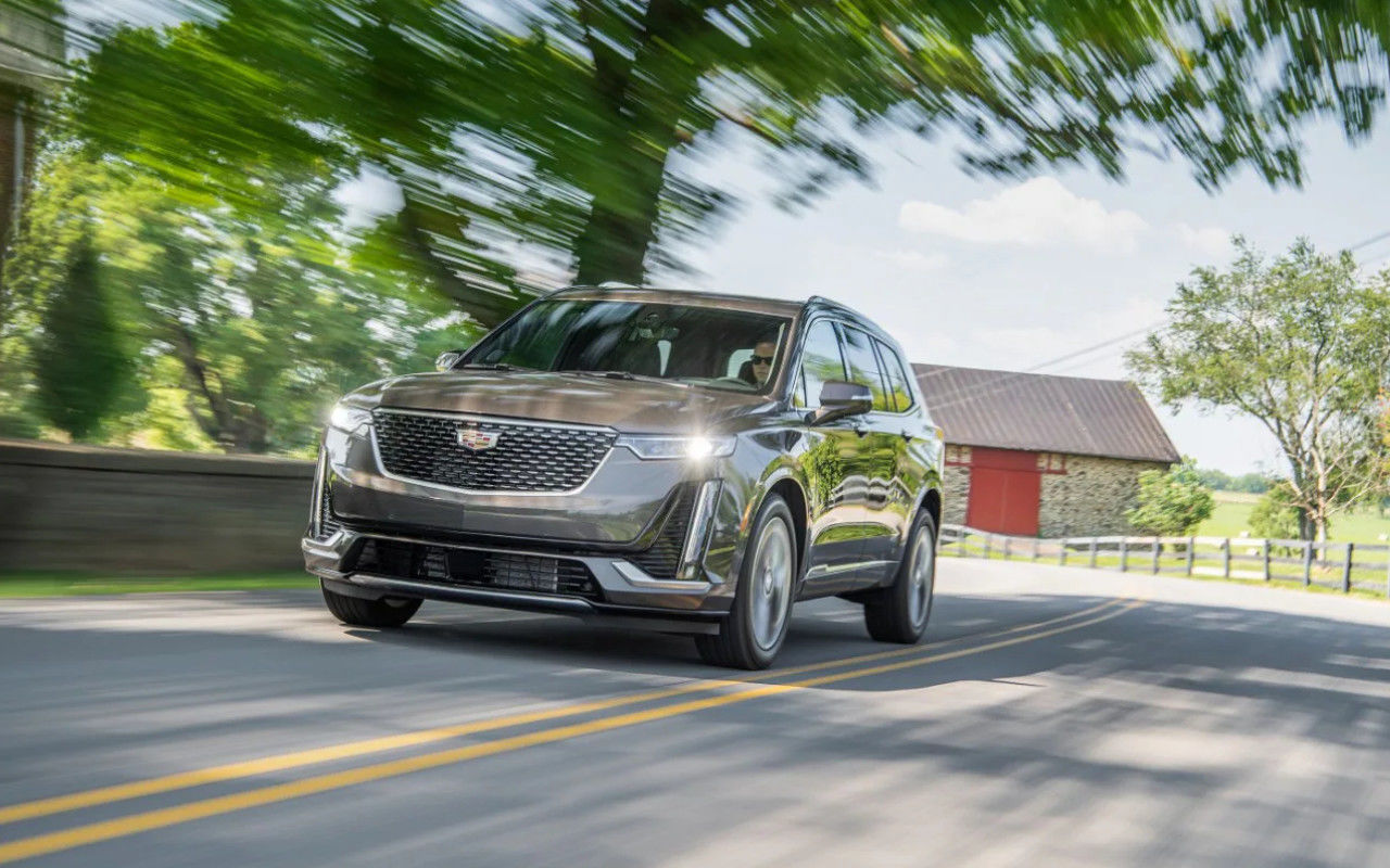 front side view of a 2020 Cadillac XT6 on a country road