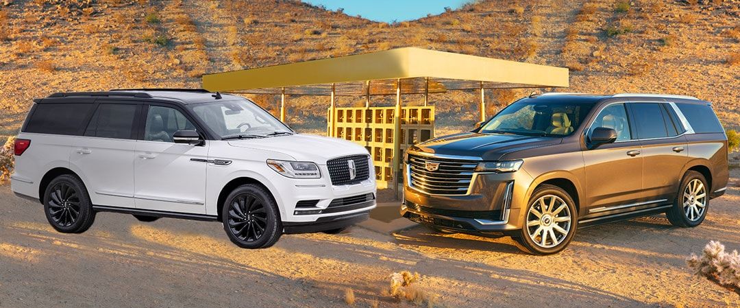 comparing the 2021 Lincoln Navigator (left) and the 2021 Cadillac Escalade (right)