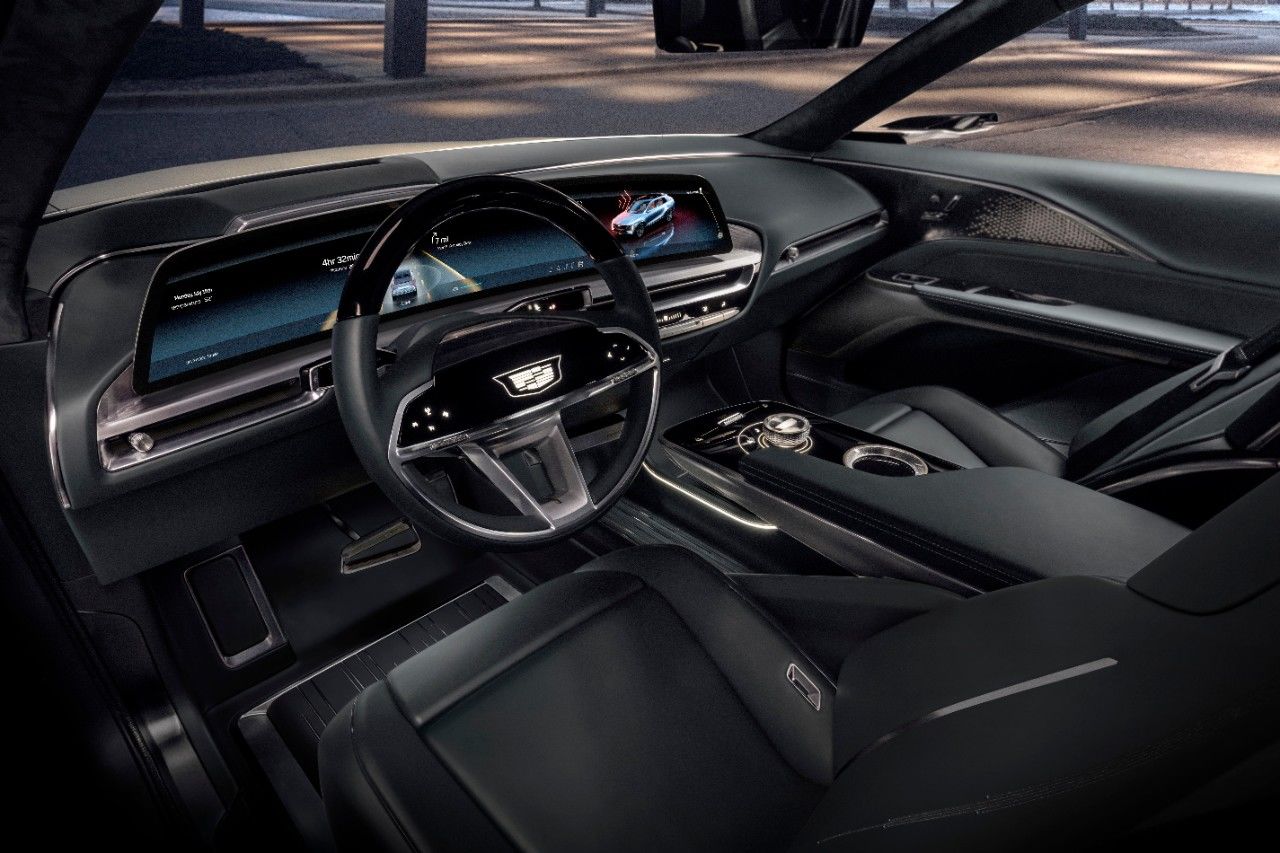 the spacious interior of the 2021 Cadillac Lyriq, black design, with the dashboard showing the 32-inch curved LED screen