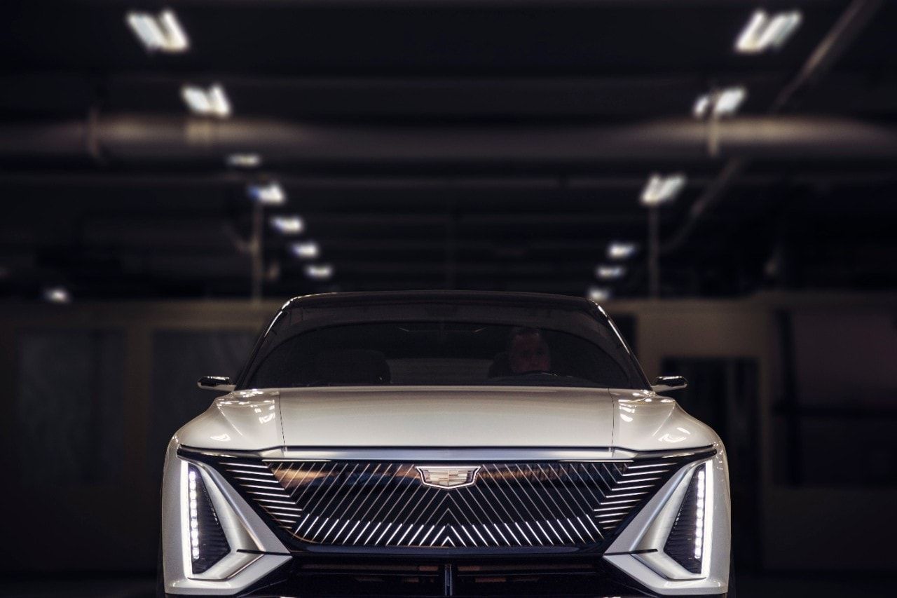the front of the 2021 Cadillac Lyriq with its headlights on