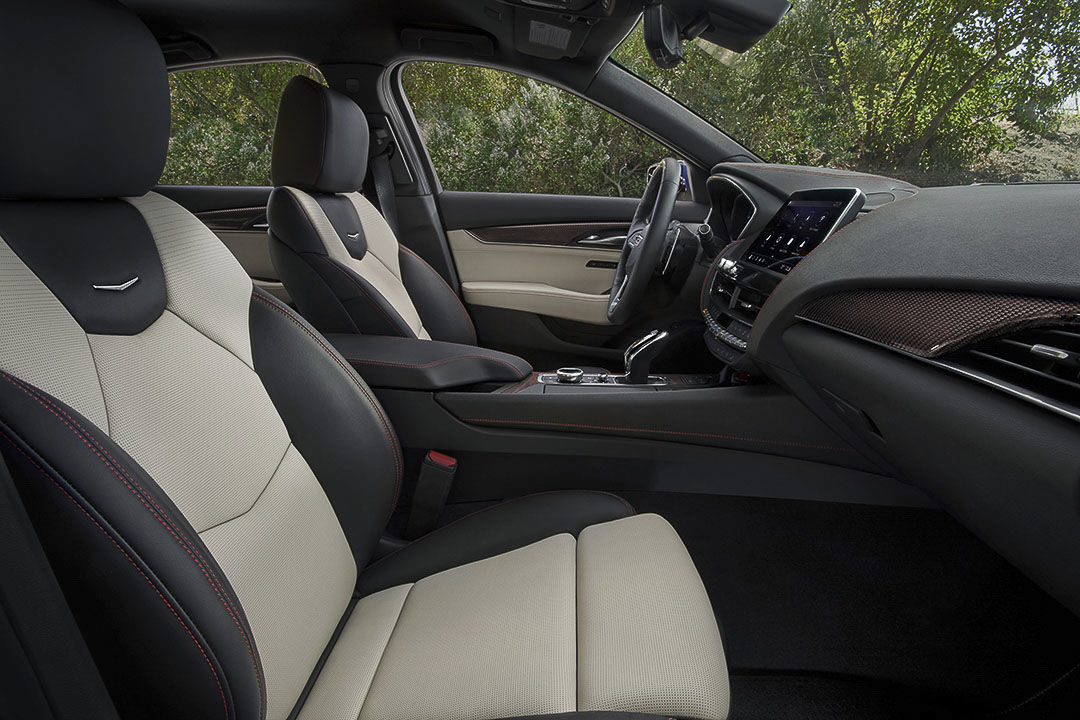 view of the front row seats, central console and steering wheel inside of the 2021 Cadillac CT5-V