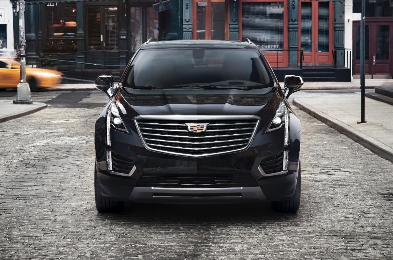 front of the 2017 Cadillac XT5 Luxuary, stopped on a brick street in town