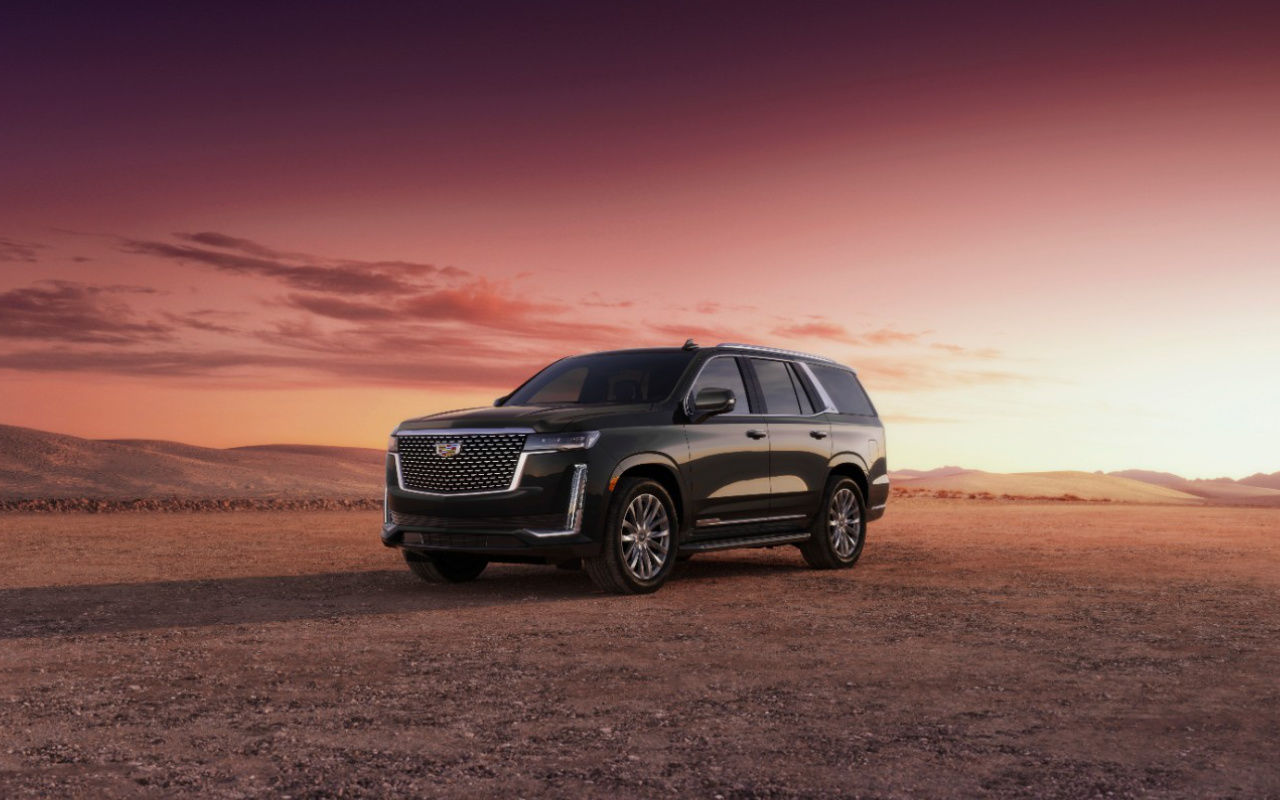 front side view of a 2023 Cadillac Escalade in the desert at dusk