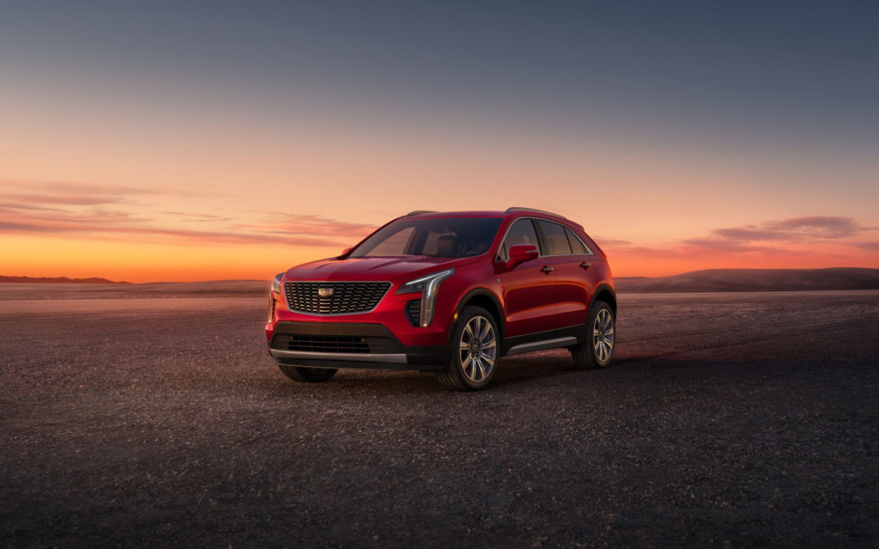 front side view of a 2023 Cadillac XT4 in the desert at dusk