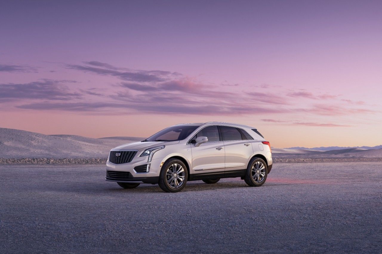 The Cadillac XT5 in the desert at sunset.