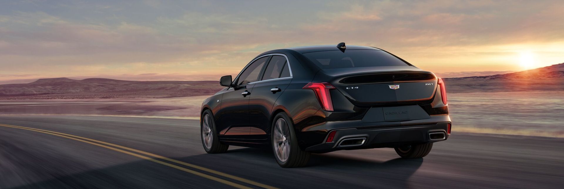 Rear view of a Cadillac CT4 on the road.