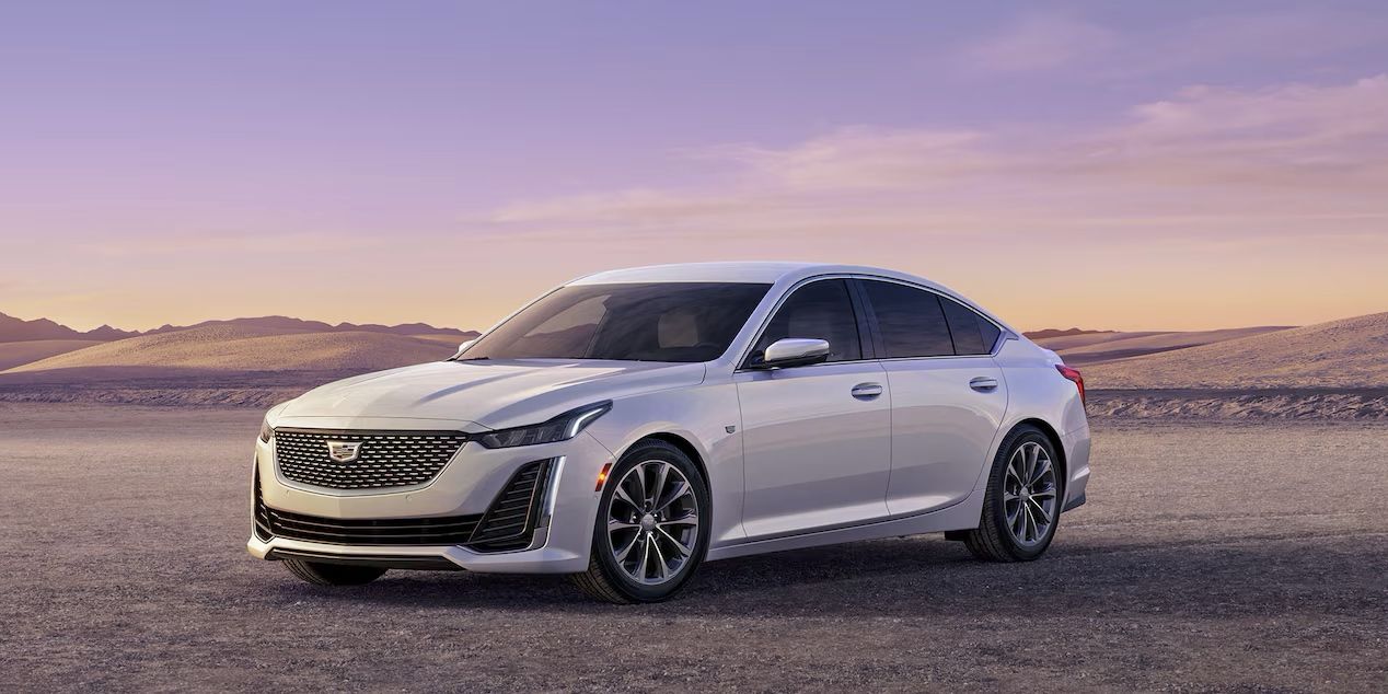 The Cadillac CT5 parked at sunset.