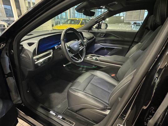 View of the front seats and dashboard console of a used Cadillac Lyriq.