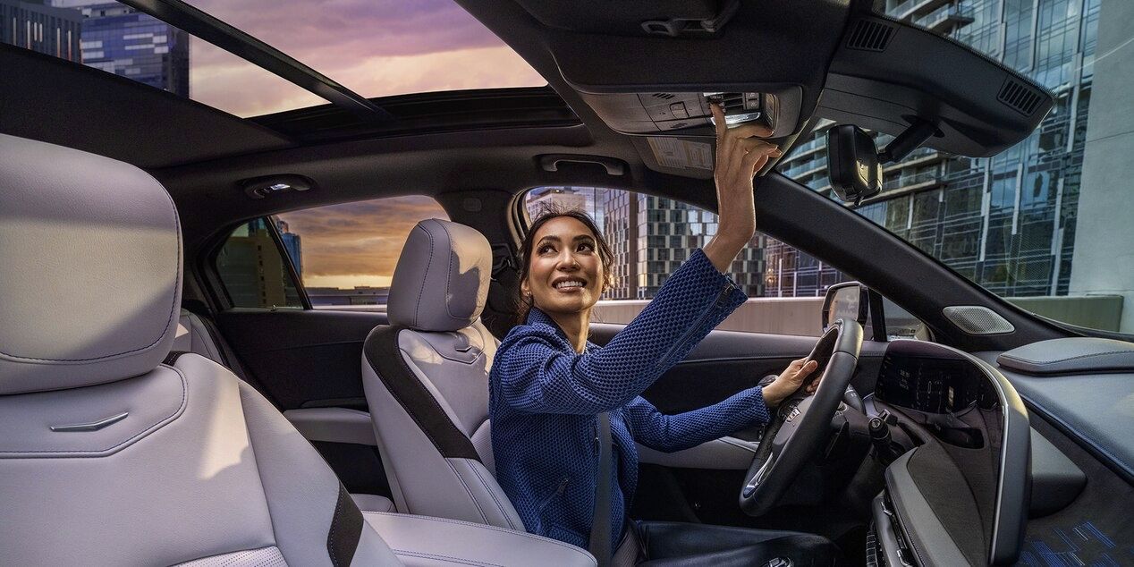 Great view of the front seats and panoramic roof of the Cadillac XT4.