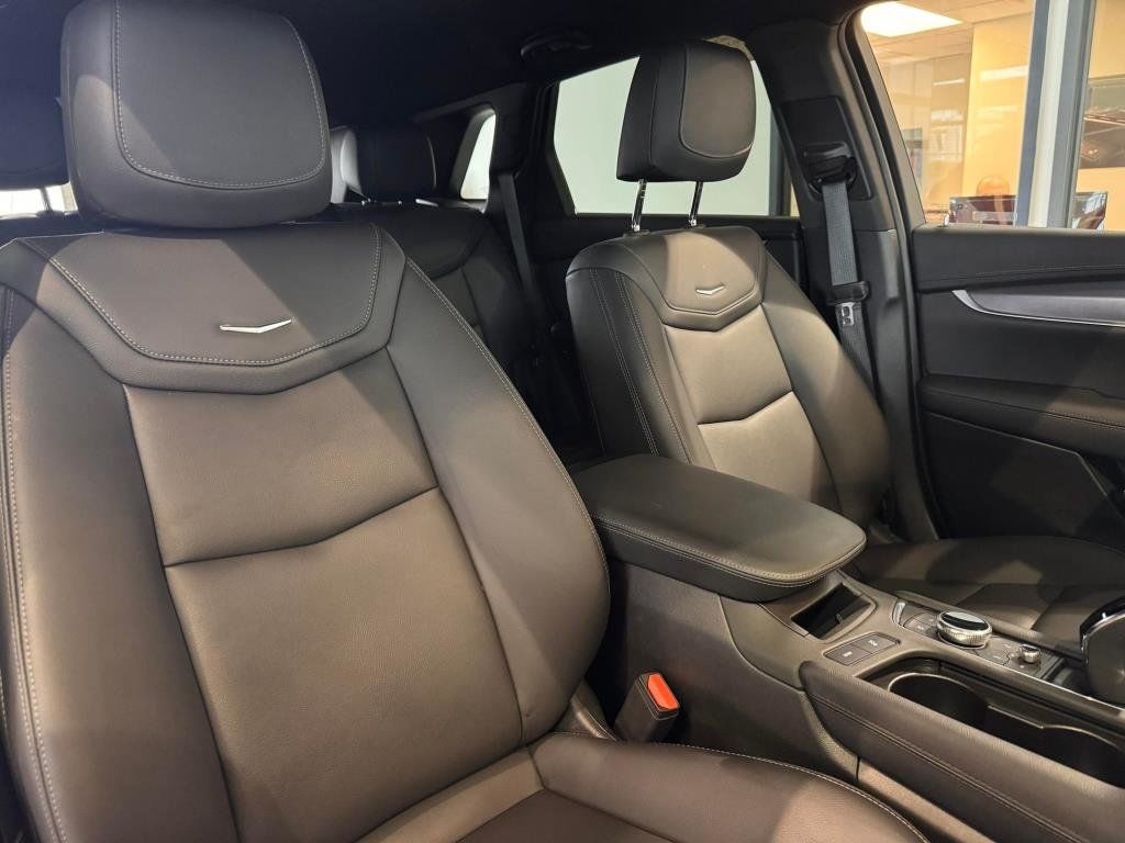 Nice view of the front seats of a used Cadillac XT5.