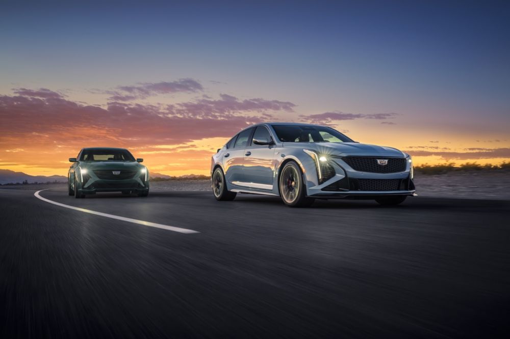 Cadillac CT5-V and Cadillac CT5-V Blackwing driving on a road.