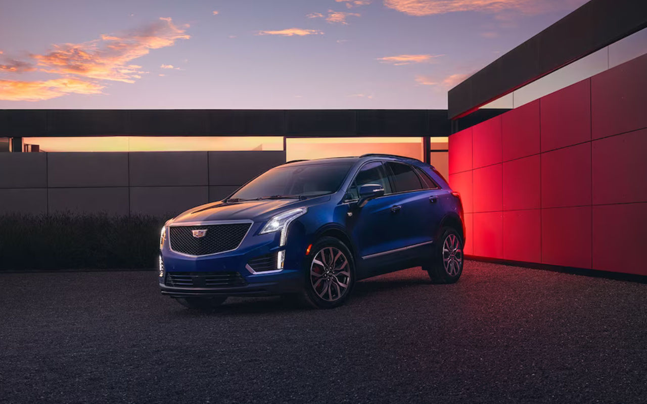 The Cadillac XT5 parked in front of a residence.