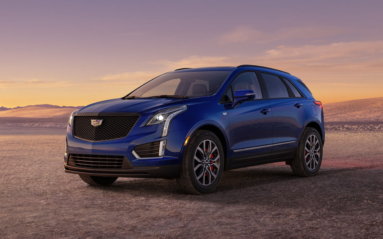 front side view of a 2025 Cadillac XT5 in the desert