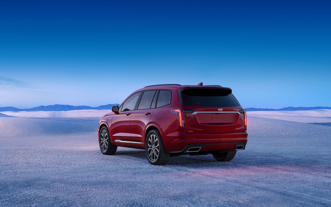 rear side view of a 2025 Cadillac XT6 in the desert