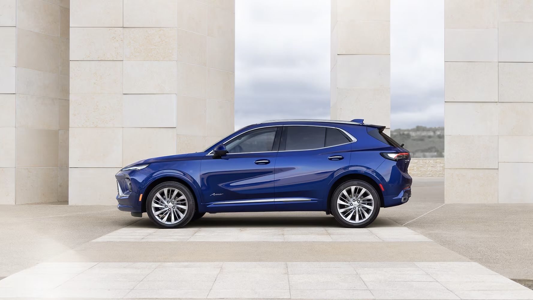 The Buick Envision parked in front of a building.