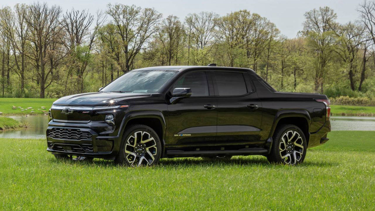 The Chevrolet Silverado EV 2025 parked in the grass.