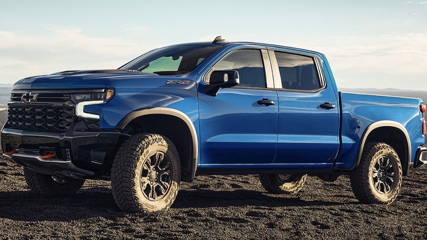 The Chevrolet Silverado 2025 parked on a sandy road.