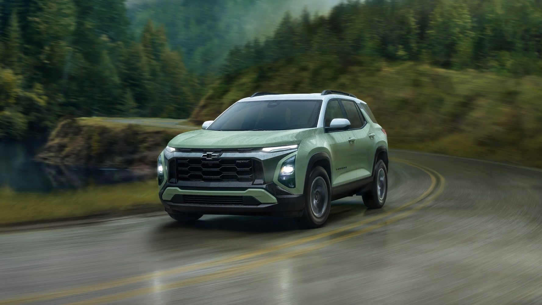 The Chevrolet Equinox 2025 on a wet road in a curve.