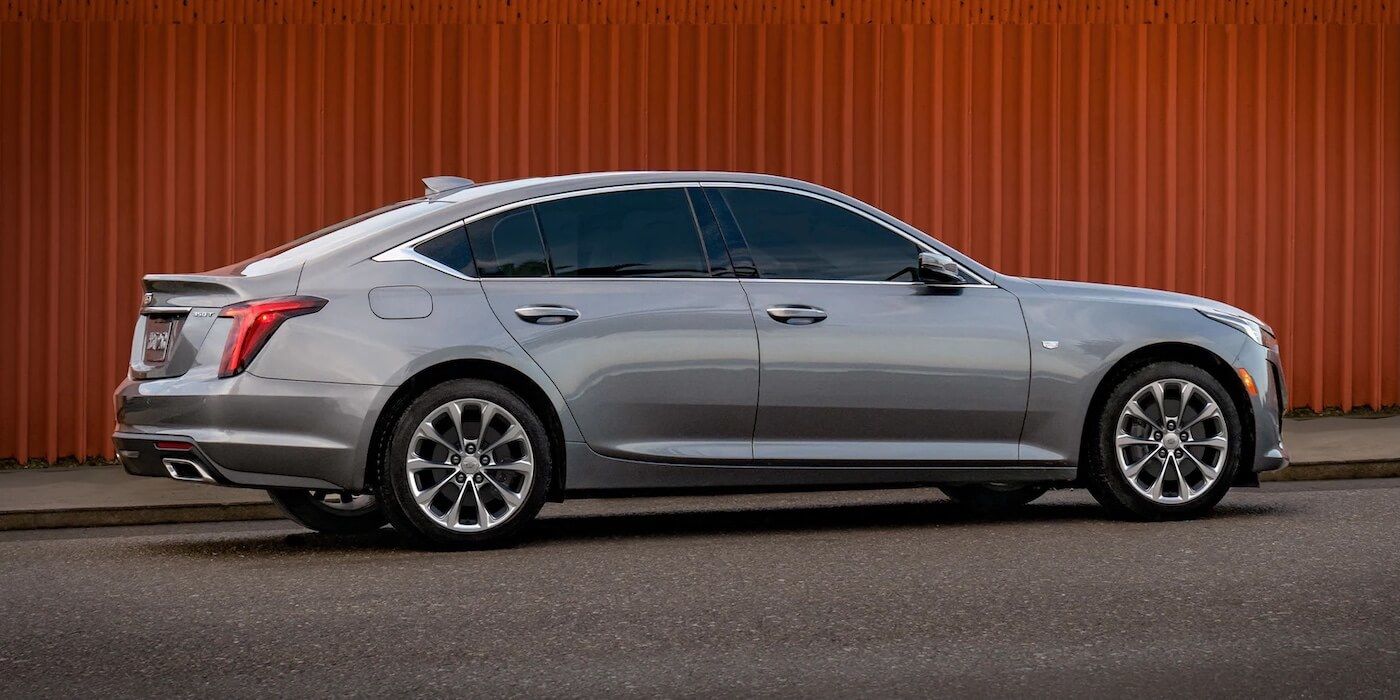 Side view of a gray 2021 Cadillac CT5 parked alongside a wall